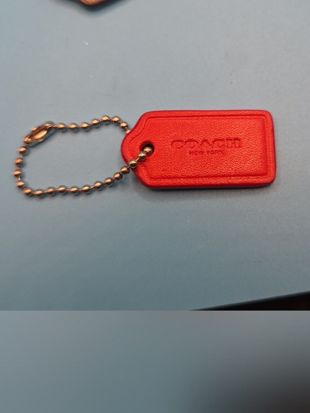 Coach Red Leather Tag Keychain with Gold Chain Accent